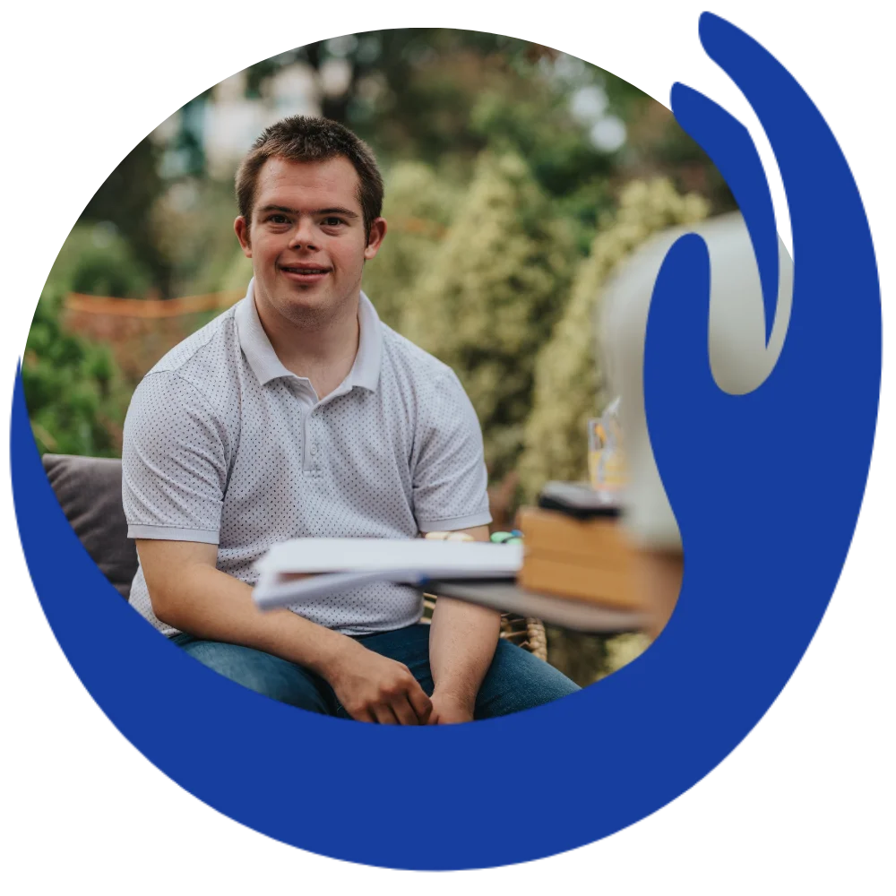 Disabled man with down syndrome smiling at camera